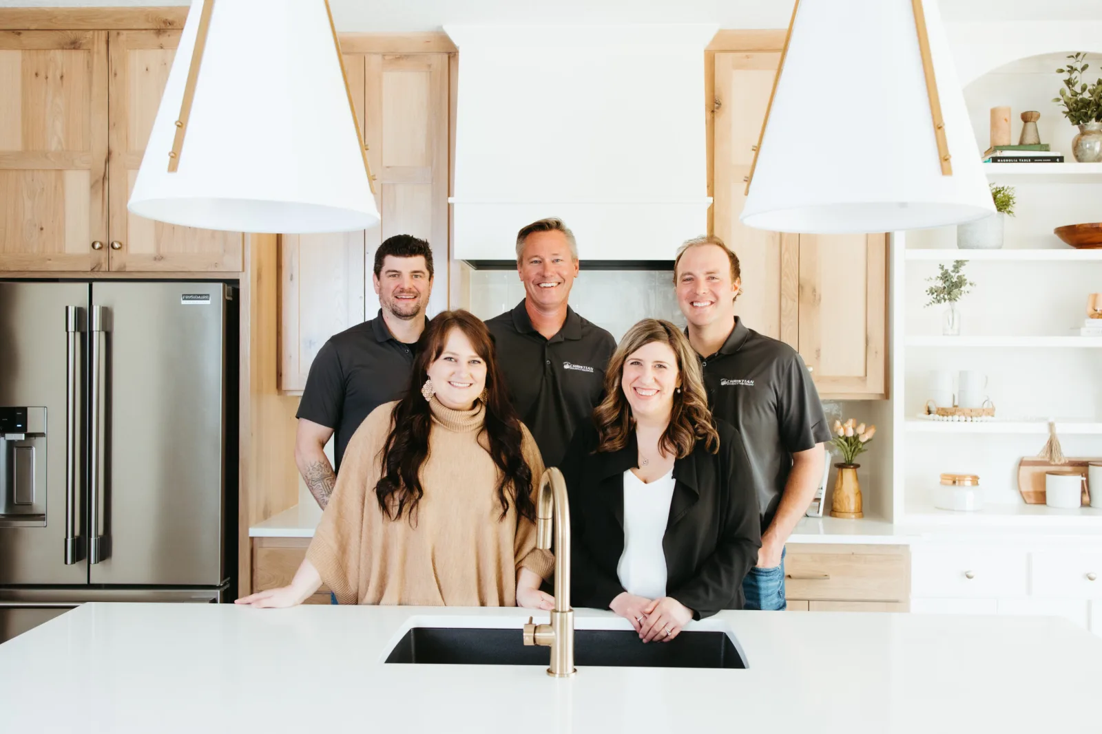 The Christian Builders & Remodelers team gathered outside a completed home